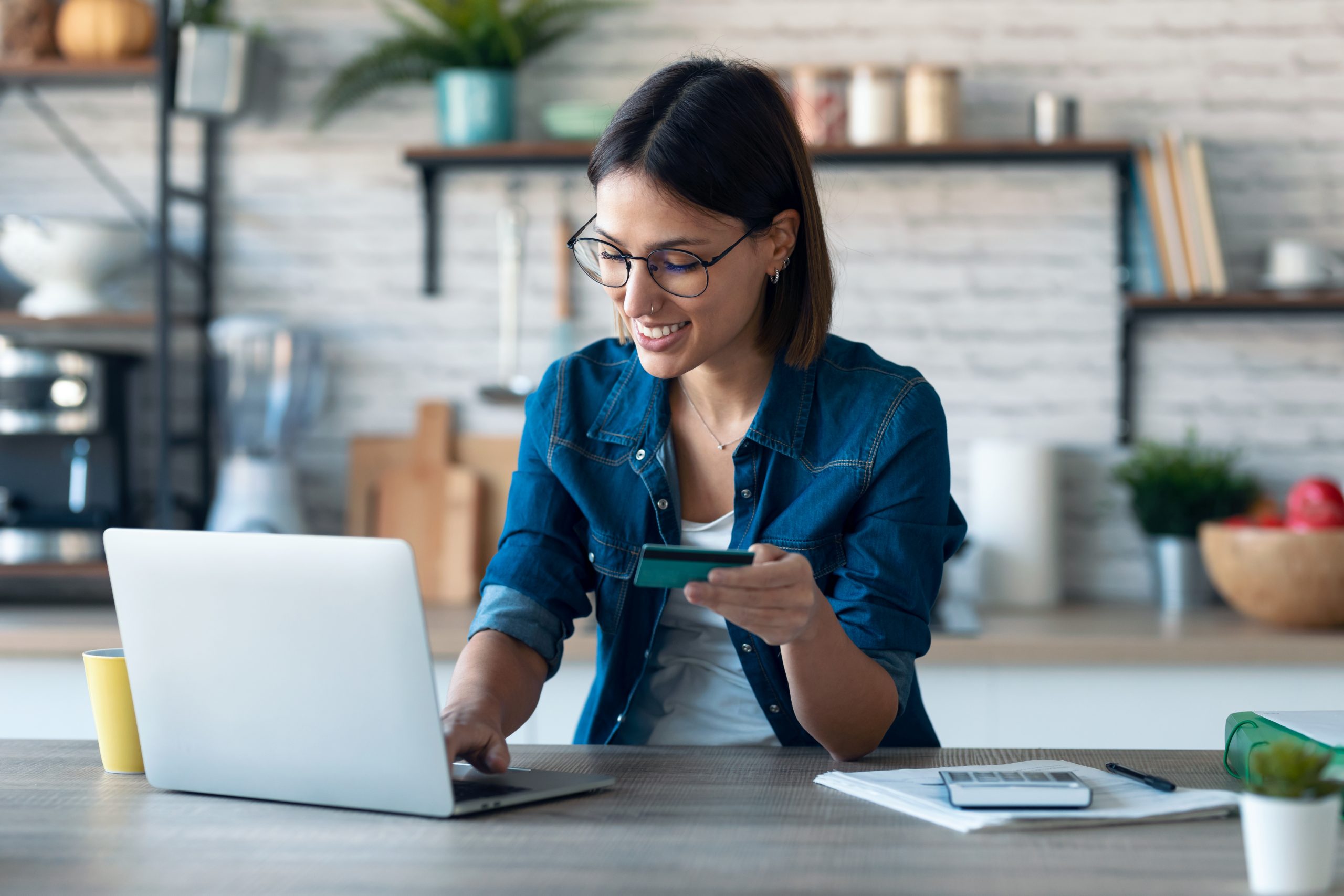 Cute Young Woman Holding White Credit Card For Shopping Online W